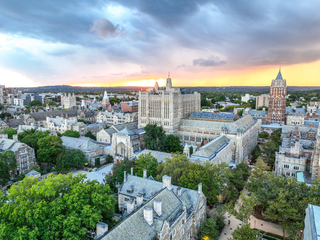 Sprawling aerial view of Central Campus's gothic architecture at sunset
